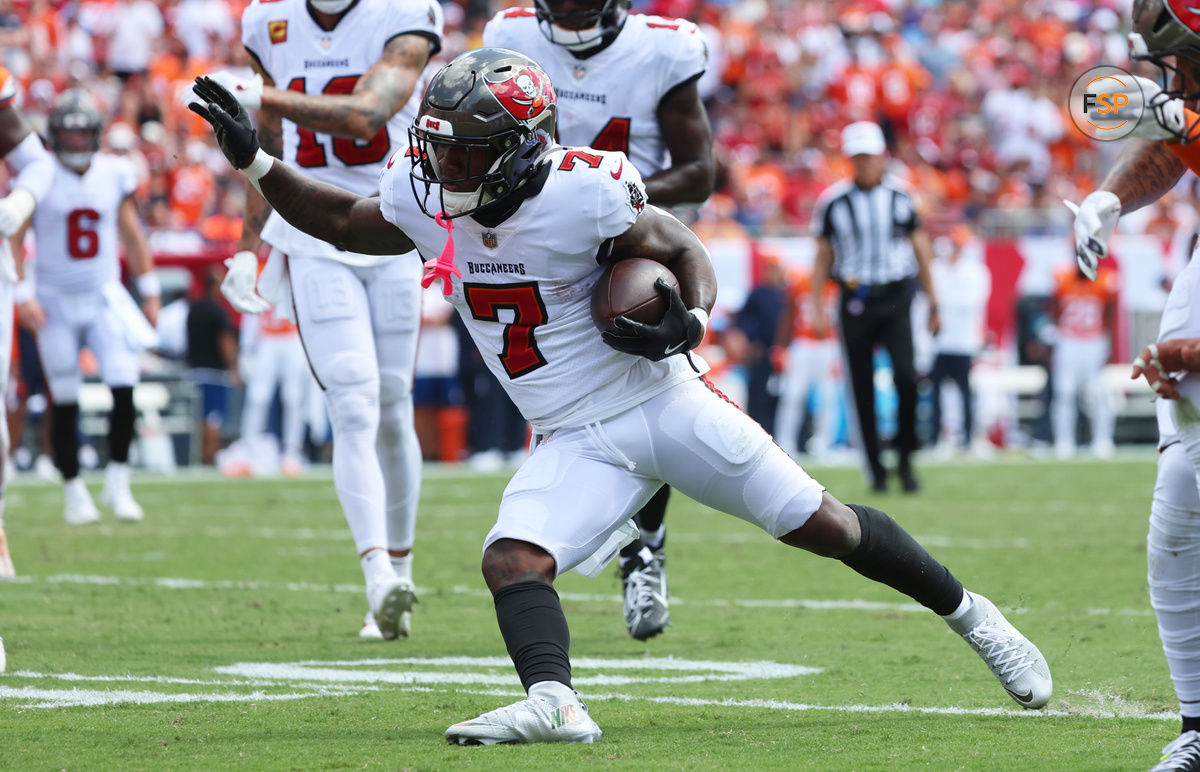 Sep 22, 2024; Tampa, Florida, USA; Tampa Bay Buccaneers running back Bucky Irving (7) runs with the ball against the Denver Broncos during the first half at Raymond James Stadium. Credit: Kim Klement Neitzel-Imagn Images