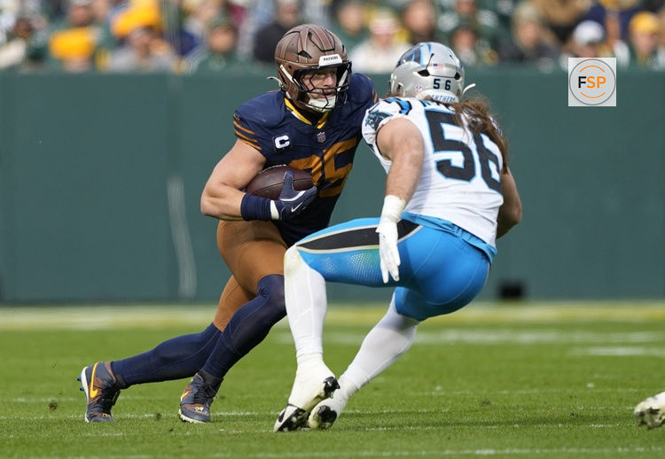 Nov 2, 2025; Green Bay, Wisconsin, USA; Green Bay Packers tight end Tucker Kraft (85) runs after a catch against Carolina Panthers linebacker Christian Rozeboom (56) during the first half at Lambeau Field. Credit: Jeff Hanisch-Imagn Images