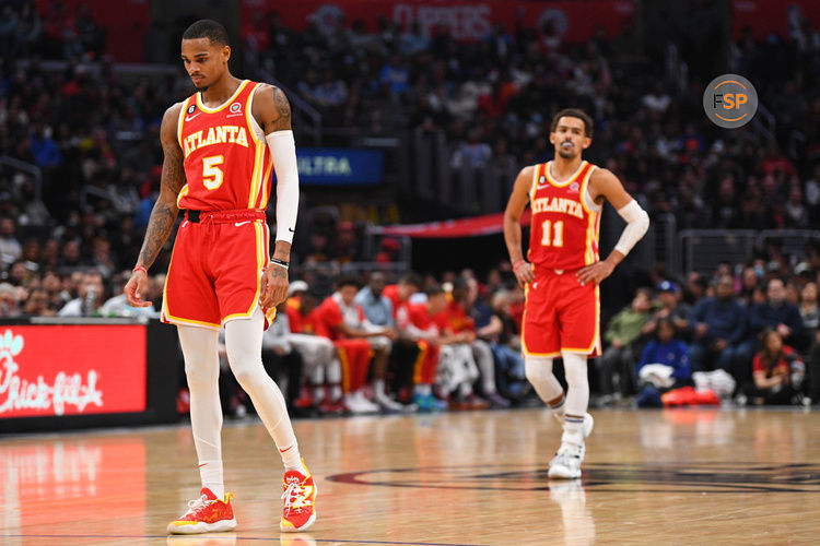 LOS ANGELES, CA - JANUARY 08: Atlanta Hawks Guard Dejounte Murray (5) and Atlanta Hawks Guard Trae Young (11) look on during a NBA game between the Atlanta Hawks and the Los Angeles Clippers on January 8, 2023 at Crypto.com Arena in Los Angeles, CA. (Photo by Brian Rothmuller/Icon Sportswire)
