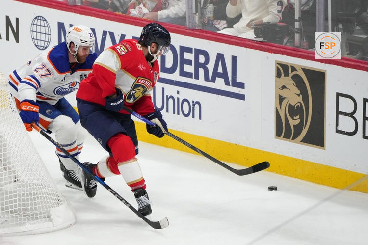 Jun 17, 2025; Sunrise, Florida, USA; Edmonton Oilers defenseman Brett Kulak (27) defends against Florida Panthers center Aleksander Barkov (16) during the second period in game six of the 2025 Stanley Cup Final at Amerant Bank Arena. Credit: Jim Rassol-Imagn Images