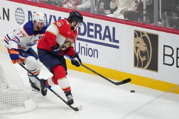 Jun 17, 2025; Sunrise, Florida, USA; Edmonton Oilers defenseman Brett Kulak (27) defends against Florida Panthers center Aleksander Barkov (16) during the second period in game six of the 2025 Stanley Cup Final at Amerant Bank Arena. Mandatory Credit: Jim Rassol-Imagn Images