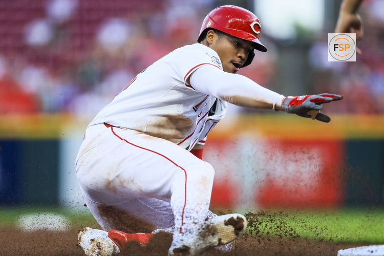 Aug 13, 2025; Cincinnati, Ohio, USA; Cincinnati Reds outfielder Noelvi Marte (16) slides into third after hitting a single in the sixth inning against the Philadelphia Phillies at Great American Ball Park. He scores on two throwing errors by Philadelphia Phillies outfielder Brandon Marsh (not pictured) and starting pitcher Cristopher Sanchez (not pictured). Credit: Katie Stratman-Imagn Images