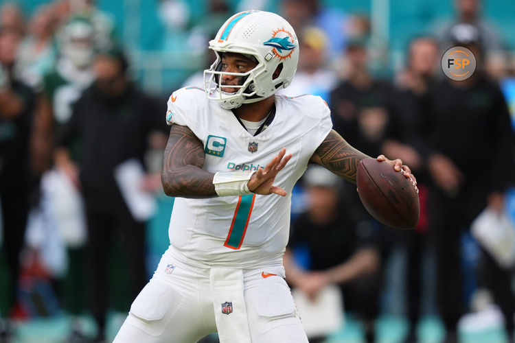 Dec 8, 2024; Miami Gardens, Florida, USA; Miami Dolphins quarterback Tua Tagovailoa (1) attempts a pass against the New York Jets during the second half at Hard Rock Stadium. Credit: Jasen Vinlove-Imagn Images