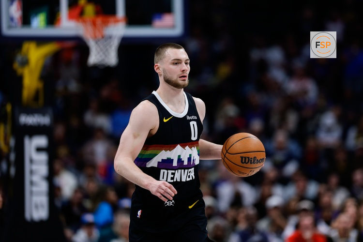 Feb 11, 2026; Denver, Colorado, USA; Denver Nuggets guard Christian Braun (0) controls the ball in the first quarter against the Memphis Grizzlies at Ball Arena. Credit: Isaiah J. Downing-Imagn Images