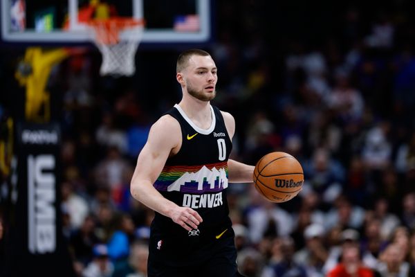 Feb 11, 2026; Denver, Colorado, USA; Denver Nuggets guard Christian Braun (0) controls the ball in the first quarter against the Memphis Grizzlies at Ball Arena. Mandatory Credit: Isaiah J. Downing-Imagn Images