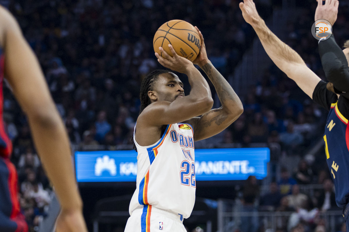 Nov 27, 2024; San Francisco, California, USA; Oklahoma City Thunder guard Cason Wallace (22) shoots against the Golden State Warriors during the first half at Chase Center. Credit: John Hefti-Imagn Images