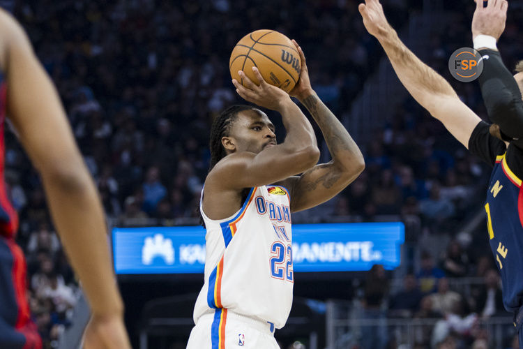 Nov 27, 2024; San Francisco, California, USA; Oklahoma City Thunder guard Cason Wallace (22) shoots against the Golden State Warriors during the first half at Chase Center. Credit: John Hefti-Imagn Images