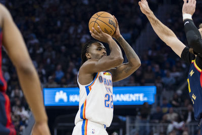 Nov 27, 2024; San Francisco, California, USA; Oklahoma City Thunder guard Cason Wallace (22) shoots against the Golden State Warriors during the first half at Chase Center. Mandatory Credit: John Hefti-Imagn Images