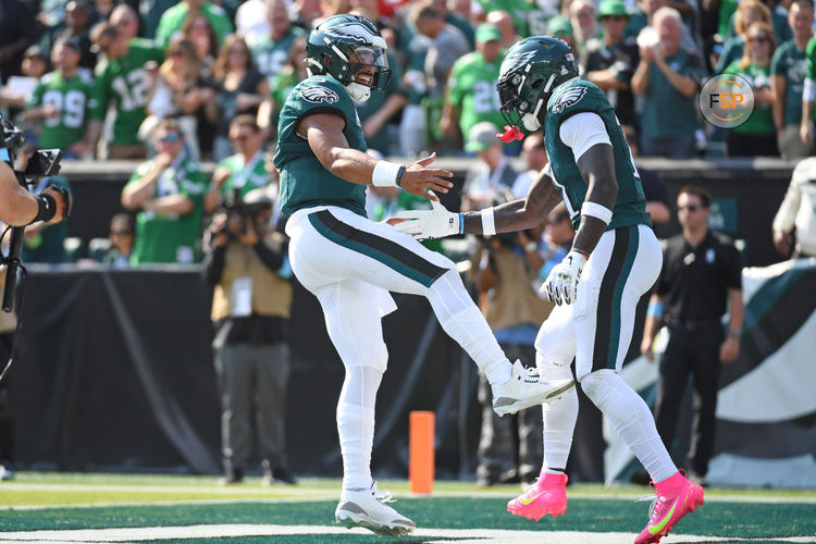 Oct 13, 2024; Philadelphia, Pennsylvania, USA; Philadelphia Eagles quarterback Jalen Hurts (1) and wide receiver A.J. Brown (11) celebrate touchdown against the Cleveland Browns during the second quarter at Lincoln Financial Field. Credit: Eric Hartline-Imagn Images