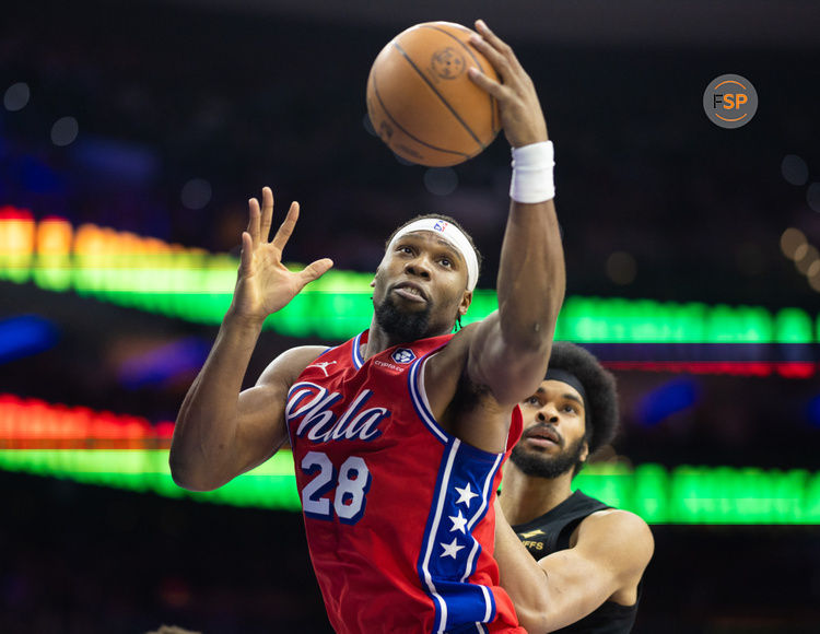 Jan 24, 2025; Philadelphia, Pennsylvania, USA; Philadelphia 76ers forward Guerschon Yabusele (28) rebounds the ball past Cleveland Cavaliers center Jarrett Allen (31) during the third quarter at Wells Fargo Center. Credit: Bill Streicher-Imagn Images