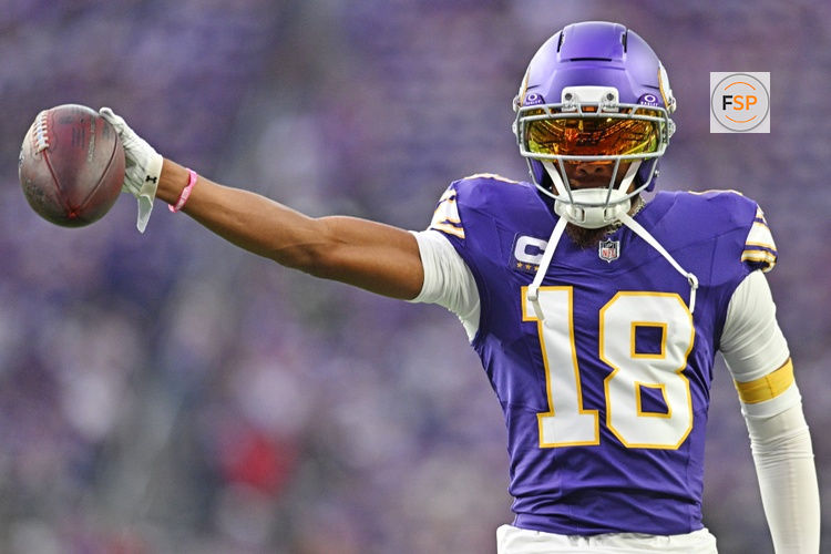 Sep 14, 2025; Minneapolis, Minnesota, USA; Minnesota Vikings wide receiver Justin Jefferson (18) holds out the ball before the game against the Atlanta Falcons at U.S. Bank Stadium. Credit: Jeffrey Becker-Imagn Images