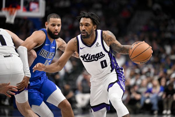 Feb 26, 2026; Dallas, Texas, USA; Sacramento Kings guard Malik Monk (0) moves the past Dallas Mavericks forward Caleb Martin (16) during the second half at the American Airlines Center. Mandatory Credit: Jerome Miron-Imagn Images