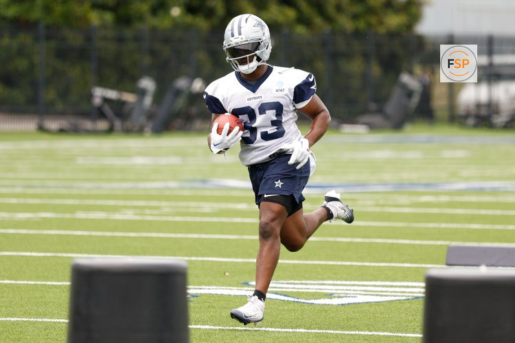 Jun 10, 2025; Arlington, TX, USA;  Dallas Cowboys running back Javonte Williams (33) goes through a drill during practice at the Ford Center at the Star Training Facility in Frisco, Texas. Credit: Chris Jones-Imagn Images