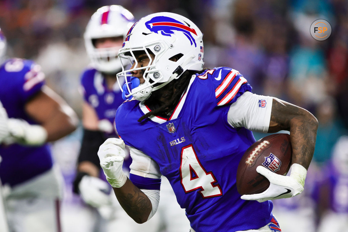 Jan 7, 2024; Miami Gardens, Florida, USA; Buffalo Bills running back James Cook (4) runs with the football against the Miami Dolphins during the fourth quarter at Hard Rock Stadium. Credit: Sam Navarro-USA TODAY Sports