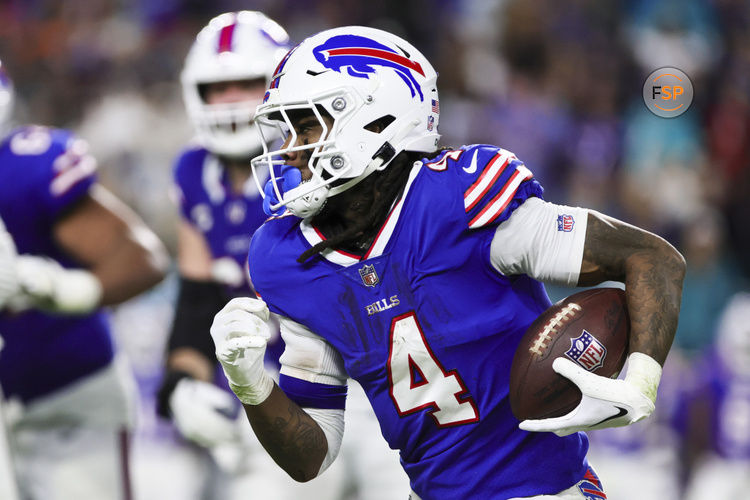 Jan 7, 2024; Miami Gardens, Florida, USA; Buffalo Bills running back James Cook (4) runs with the football against the Miami Dolphins during the fourth quarter at Hard Rock Stadium. Credit: Sam Navarro-USA TODAY Sports