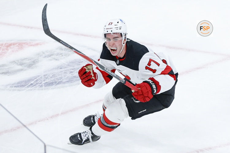 Nov 12, 2025; Chicago, Illinois, USA; New Jersey Devils defenseman Simon Nemec (17) celebrates after scoring a game winning goal against Chicago Blackhawks goaltender Spencer Knight during the overtime at United Center. Credit: Kamil Krzaczynski-Imagn Images