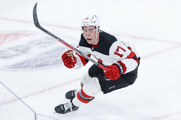 Nov 12, 2025; Chicago, Illinois, USA; New Jersey Devils defenseman Simon Nemec (17) celebrates after scoring a game winning goal against Chicago Blackhawks goaltender Spencer Knight during the overtime at United Center. Mandatory Credit: Kamil Krzaczynski-Imagn Images
