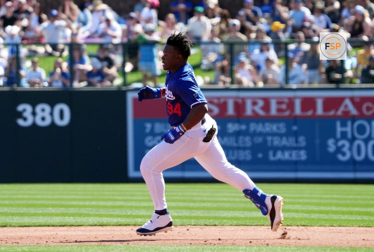 Feb 23, 2025; Phoenix, Arizona, USA; Los Angeles Dodgers right fielder Zyhir Hope (94) runs to second base en route to an RBI double against the San Diego Padres during the second inning at Camelback Ranch-Glendale. Credit: Joe Camporeale-Imagn Images