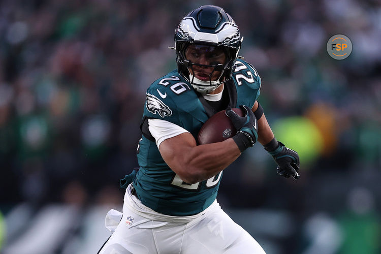 Jan 12, 2025; Philadelphia, Pennsylvania, USA; Philadelphia Eagles running back Saquon Barkley (26) rushes the ball against the Green Bay Packers during the first quarter in the NFC wild card game at Lincoln Financial Field. Credit: Bill Streicher-Imagn Images