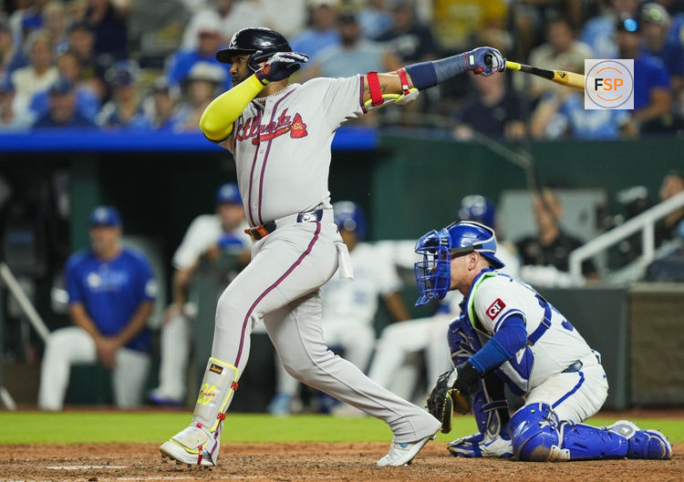 Jul 29, 2025; Kansas City, Missouri, USA; Atlanta Braves designated hitter Marcell Ozuna (20) hits an RBI single during the seventh inning against the Kansas City Royals at Kauffman Stadium. Credit: Jay Biggerstaff-Imagn Images