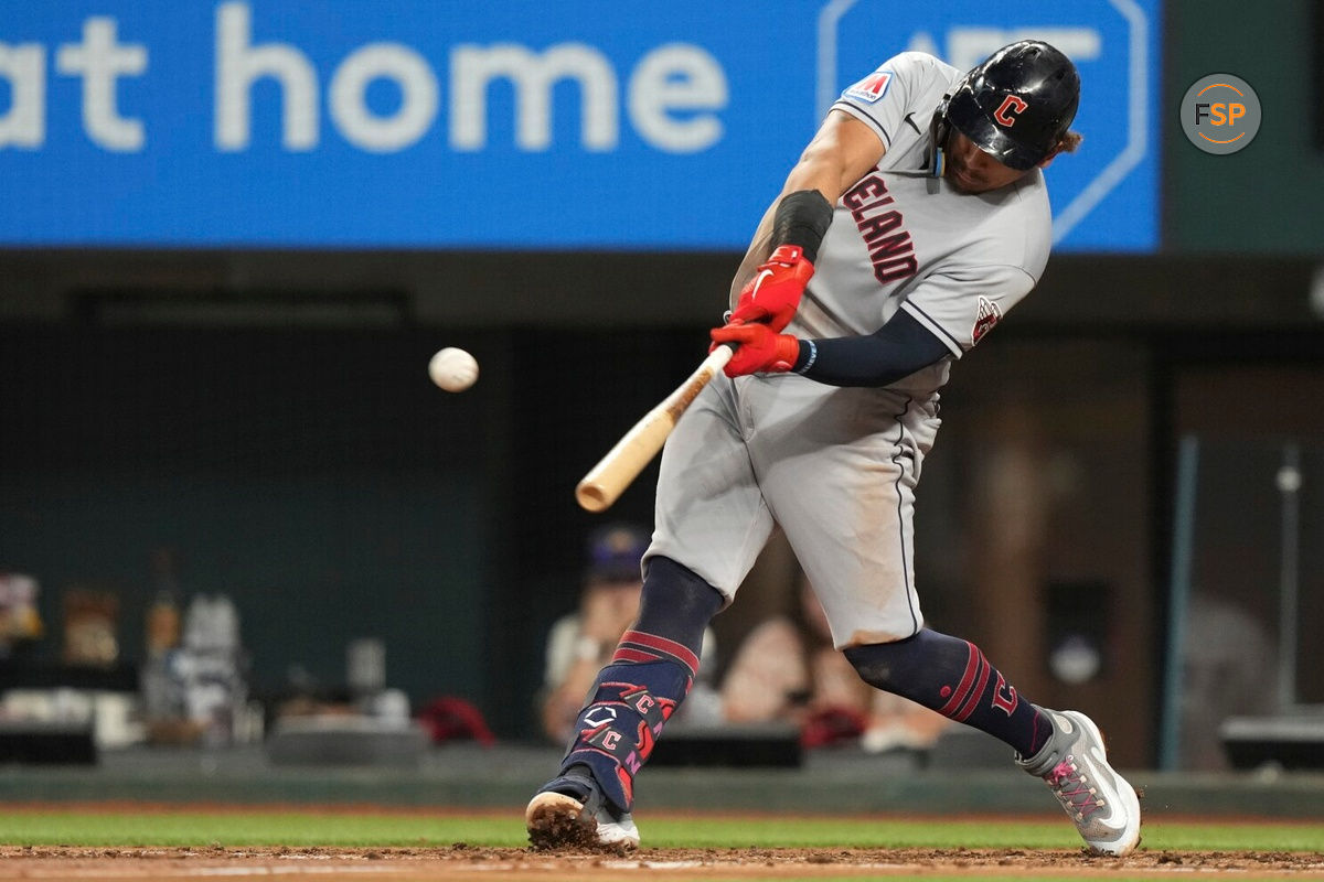 Cleveland Guardians Josh Naylor hits a home run that also scored teammate Myles Straw during the third inning of a baseball game against the Texas Rangers in Arlington, Texas, Friday, July 14, 2023. (AP Photo/LM Otero)