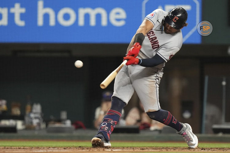 Cleveland Guardians Josh Naylor hits a home run that also scored teammate Myles Straw during the third inning of a baseball game against the Texas Rangers in Arlington, Texas, Friday, July 14, 2023. (AP Photo/LM Otero)