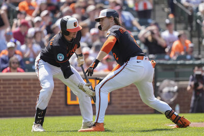 May 18, 2025; Baltimore, Maryland, USA; Baltimore Orioles first baseman Ryan O'Hearn (32) congratulates Baltimore Orioles shortstop Gunnar Henderson (2) for hitting a home run against the Washington Nationals during the sixth inning at Oriole Park at Camden Yards. Mandatory Credit: Gregory Fisher-Imagn Images