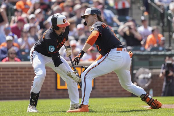 May 18, 2025; Baltimore, Maryland, USA; Baltimore Orioles first baseman Ryan O'Hearn (32) congratulates Baltimore Orioles shortstop Gunnar Henderson (2) for hitting a home run against the Washington Nationals during the sixth inning at Oriole Park at Camden Yards. Mandatory Credit: Gregory Fisher-Imagn Images