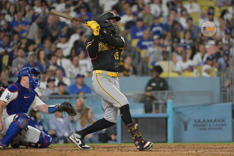 Aug 9, 2024; Los Angeles, California, USA; Pittsburgh Pirates shortstop Oneil Cruz (15) hits a solo home run in the fourth inning against the Pittsburgh Pirates at Dodger Stadium. Credit: Jayne Kamin-Oncea-USA TODAY Sports