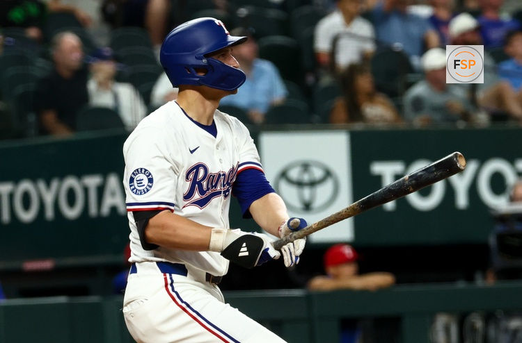 Aug 27, 2025; Arlington, Texas, USA;  Texas Rangers shortstop Corey Seager (5) hits a two-run home run during the fourth inning against the Los Angeles Angels at Globe Life Field. Credit: Kevin Jairaj-Imagn Images