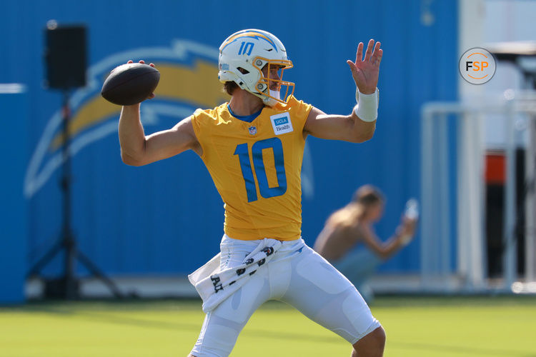 Jul 24, 2024; El Segundo, CA, USA;  Los Angeles Chargers quarterback Justin Herbert (10) throws during the first day of training camp at The Bolt. Mandatory Credit: Kiyoshi Mio-USA TODAY Sports