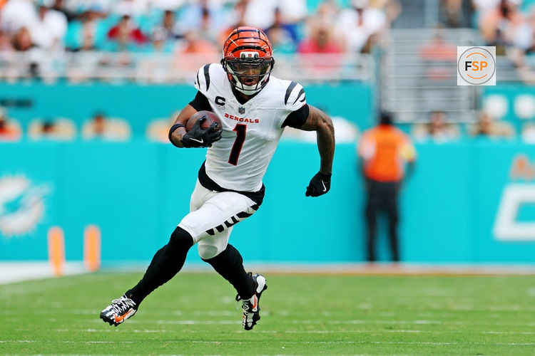 (EDITORS NOTE: caption correction) Dec 21, 2025; Miami Gardens, Florida, USA; Cincinnati Bengals receiver Ja'Marr Chase (1) runs the ball during the second quarter against the Cincinnati Bengals at Hard Rock Stadium. Credit: Nathan Ray Seebeck-Imagn Images