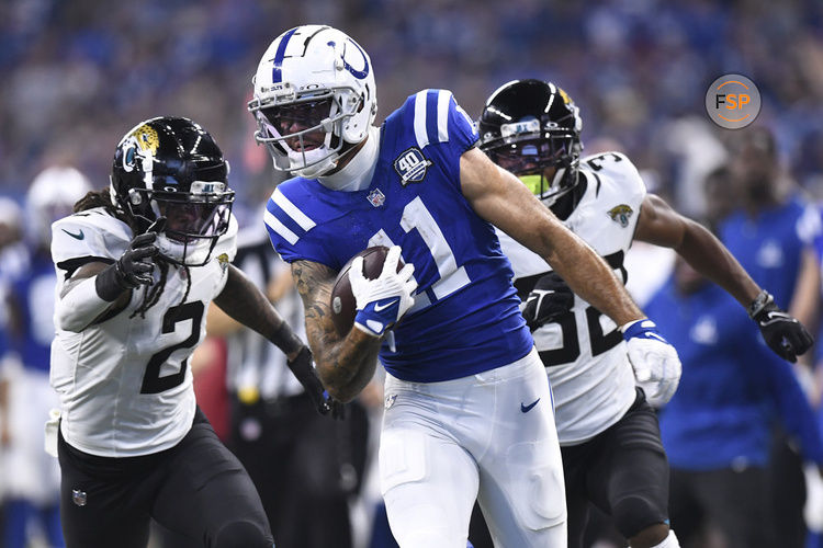 INDIANAPOLIS, IN - SEPTEMBER 10: Indianapolis Colts Wide Receiver Michael Pittman (11) carries the ball for a touchdown during the NFL game between the Jacksonville Jaguars and the Indianapolis Colts on September 10, 2023, at Lucas Oil Stadium in Indianapolis, Indiana. (Photo by Michael Allio/Icon Sportswire)