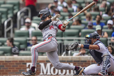 Apr 20, 2025; Cumberland, Georgia, USA; Minnesota Twins designated hitter  Luke Keaschall (15) hits a single against the Atlanta Braves during the third inning at Truist Park. Mandatory Credit: Dale Zanine-Imagn Images