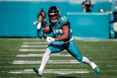 Dec 14, 2025; Jacksonville, Florida, USA;Jacksonville Jaguars running back Bhayshul Tuten (33) runs the ball against the New York Jets at EverBank Stadium. Mandatory Credit: Travis Register-Imagn Images