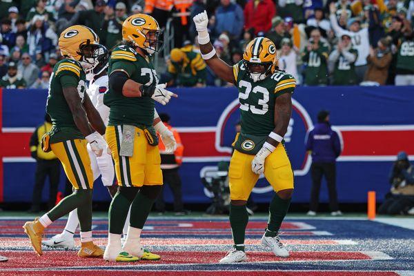 Nov 16, 2025; East Rutherford, New Jersey, USA; Green Bay Packers running back Emanuel Wilson (23) celebrates after scoring a touchdown during the second quarter against the New York Giants at MetLife Stadium. Mandatory Credit: Vincent Carchietta-Imagn Images