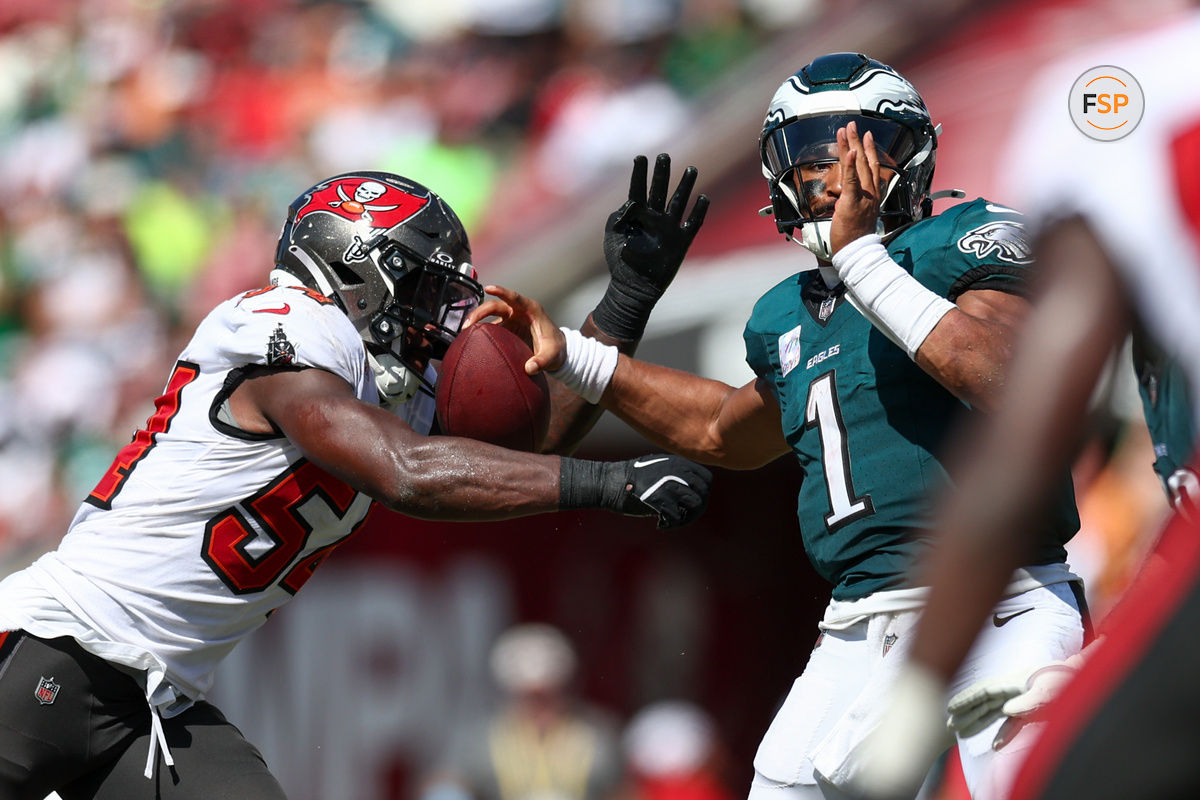 Sep 29, 2024; Tampa, Florida, USA; Tampa Bay Buccaneers linebacker Lavonte David (54) pressures Philadelphia Eagles quarterback Jalen Hurts (1) in the third quarter at Raymond James Stadium. Credit: Nathan Ray Seebeck-Imagn Images