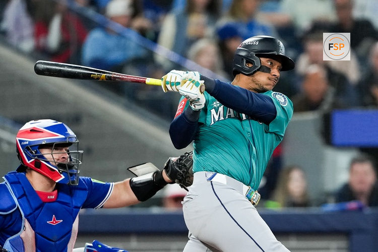 Oct 13, 2025; Toronto, Ontario, CAN; Seattle Mariners infielder Jorge Polanco (7) singles in the seventh inning against the Toronto Blue Jays during game two of the ALCS round for the 2025 MLB playoffs at Rogers Centre. Credit: Nick Turchiaro-Imagn Images
