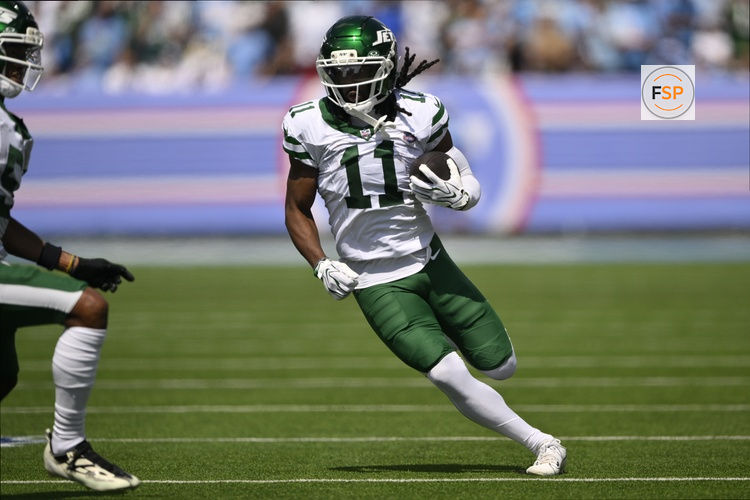 Sep 13, 2026; Nashville, Tennessee, USA;  New York Jets wide receiver Omar Cooper Jr. (11) runs with the ball against the Tennessee Titans during the first quarter at Nissan Stadium.  Credit: Steve Roberts-Imagn Images