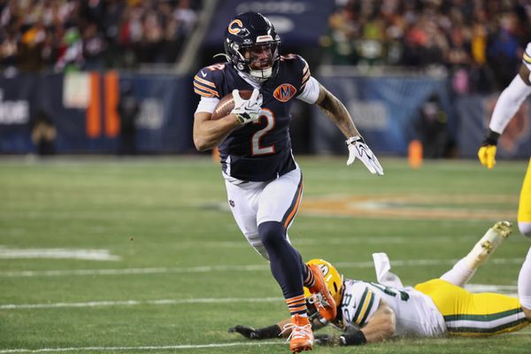 Dec 20, 2025; Chicago, Illinois, USA; Chicago Bears wide receiver DJ Moore (2) runs after the catch against Green Bay Packers guard Lecitus Smith (68) during the first quarter at Soldier Field. Mandatory Credit: Mike Dinovo-Imagn Images