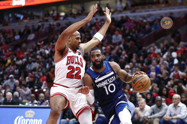 Oct 16, 2024; Chicago, Illinois, USA; Minnesota Timberwolves guard Mike Conley (10) drives to the basket against Chicago Bulls forward Talen Horton-Tucker (22) during the first half at United Center. Credit: Kamil Krzaczynski-Imagn Images