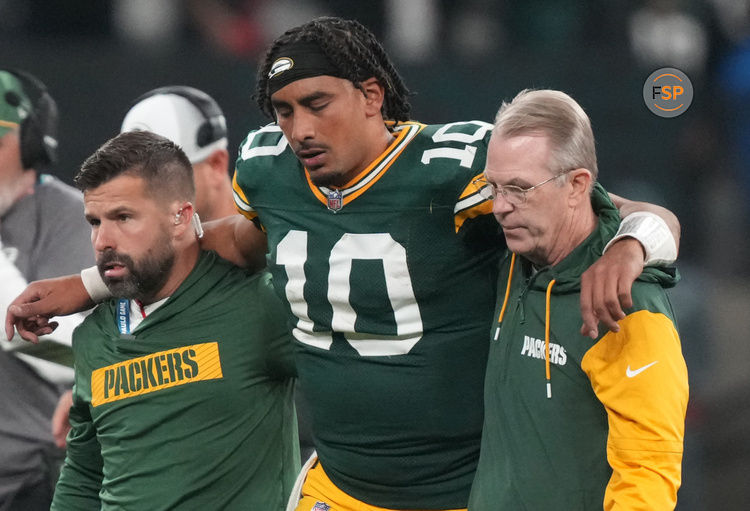 Sep 6, 2024; Sao Paulo, BRA; Green Bay Packers quarterback Jordan Love (10) is assisted off the field after an injury during the second half against the Philadelphia Eagles at Neo Quimica Arena. Credit: Kirby Lee-Imagn Images