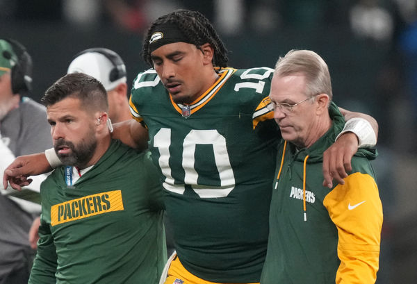 Sep 6, 2024; Sao Paulo, BRA; Green Bay Packers quarterback Jordan Love (10) is assisted off the field after an injury during the second half against the Philadelphia Eagles at Neo Quimica Arena. Mandatory Credit: Kirby Lee-Imagn Images