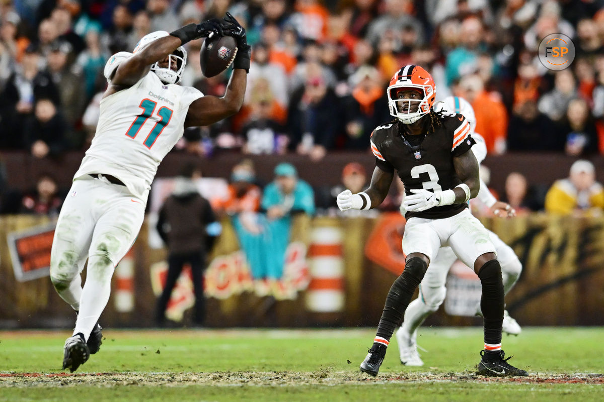 Dec 29, 2024; Cleveland, Ohio, USA; Cleveland Browns wide receiver Jerry Jeudy (3) watches as Miami Dolphins linebacker Tyrel Dodson (11) intercepts the pass during the first half at Huntington Bank Field. Credit: Ken Blaze-Imagn Images