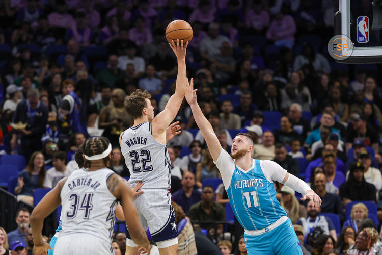 Feb 12, 2025; Orlando, Florida, USA; Orlando Magic forward Franz Wagner (22) shoots over Charlotte Hornets center Jusuf Nurkic (11) during the second quarter at Kia Center. Credit: Mike Watters-Imagn Images