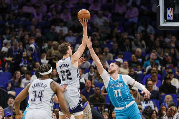 Feb 12, 2025; Orlando, Florida, USA; Orlando Magic forward Franz Wagner (22) shoots over Charlotte Hornets center Jusuf Nurkic (11) during the second quarter at Kia Center. Mandatory Credit: Mike Watters-Imagn Images