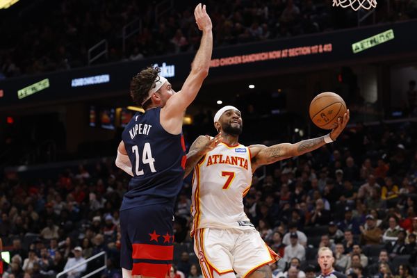 Nov 25, 2025; Washington, District of Columbia, USA; Washington Wizards forward Corey Kispert (24) prepares to block shot by Atlanta Hawks guard Nickeil Alexander-Walker (7) in the first half at Capital One Arena. Mandatory Credit: Geoff Burke-Imagn Images