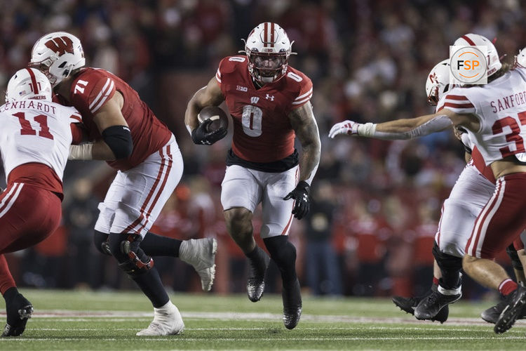MADISON, WI - NOVEMBER 18: Wisconsin Badgers running back Braelon Allen (0) hits the open hole durning a college football game between the Nebraska Cornhuskers and the Wisconsin Badgers on November 18th, 2023 at Barry Alvarez field at Camp Randall Stadium in Madison, WI. (Photo by Dan Sanger/Icon Sportswire)