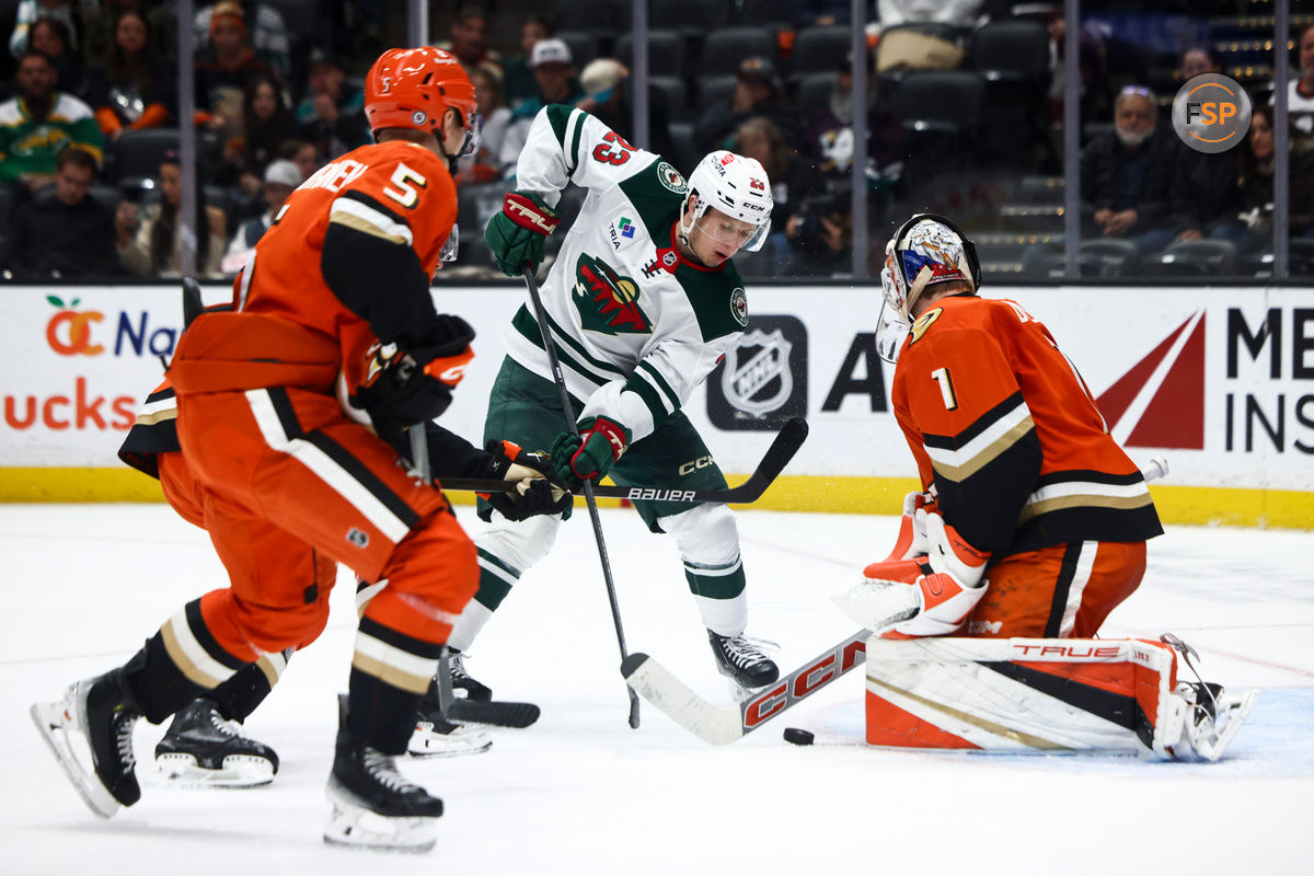 Nov 8, 2024; Anaheim, California, USA; Minnesota Wild center Marco Rossi (23) shoots the puck against Anaheim Ducks goaltender Lukas Dostal (1) during the third period of a hockey game at Honda Center. Credit: Jessica Alcheh-Imagn Images