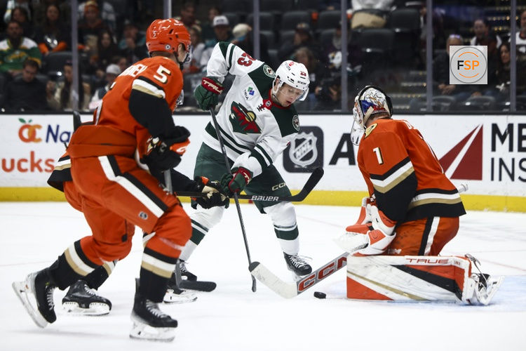 Nov 8, 2024; Anaheim, California, USA; Minnesota Wild center Marco Rossi (23) shoots the puck against Anaheim Ducks goaltender Lukas Dostal (1) during the third period of a hockey game at Honda Center. Credit: Jessica Alcheh-Imagn Images